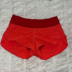 orange 2.5 in lululemon shorts